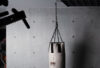 RUGA Legacy punching bag with chain suspension in an industrial setting.