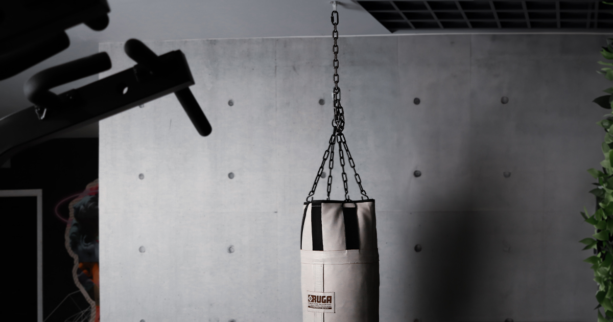 RUGA Legacy punching bag with chain suspension in an industrial setting.